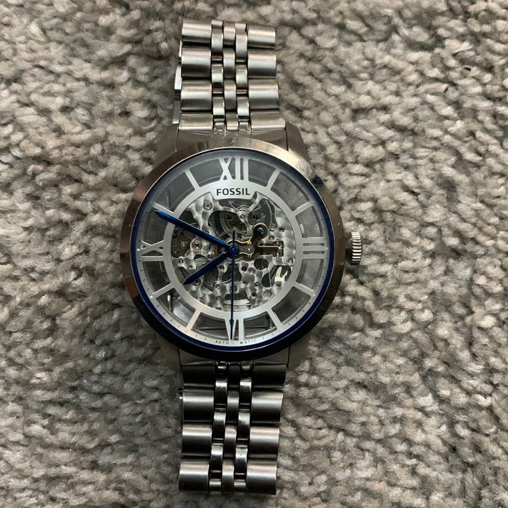 Automatic silver fossil watch.